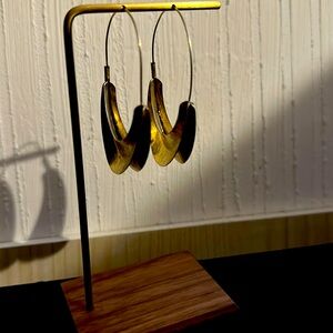 Gold tone hoop earrings.